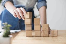 Man building wooden blocks